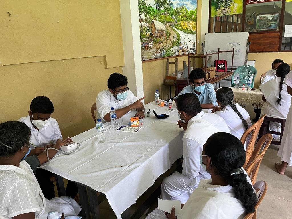 Medical volunteer consulting a patient